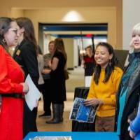 Aruna holding the program